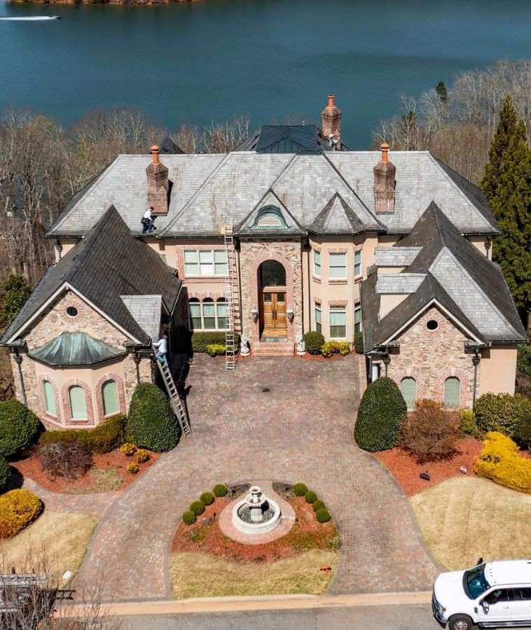 Aerial View Of A Large Home With A Roof