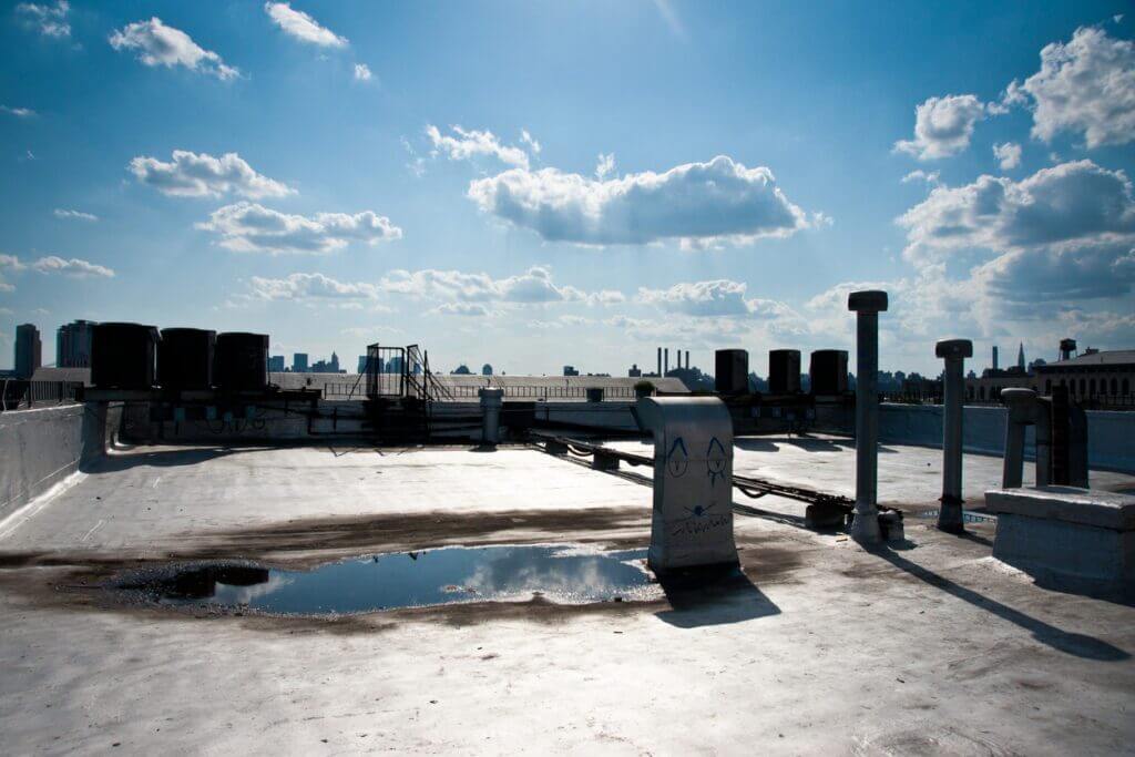 Causes of Flat Roof Leaks in Atlanta Homes